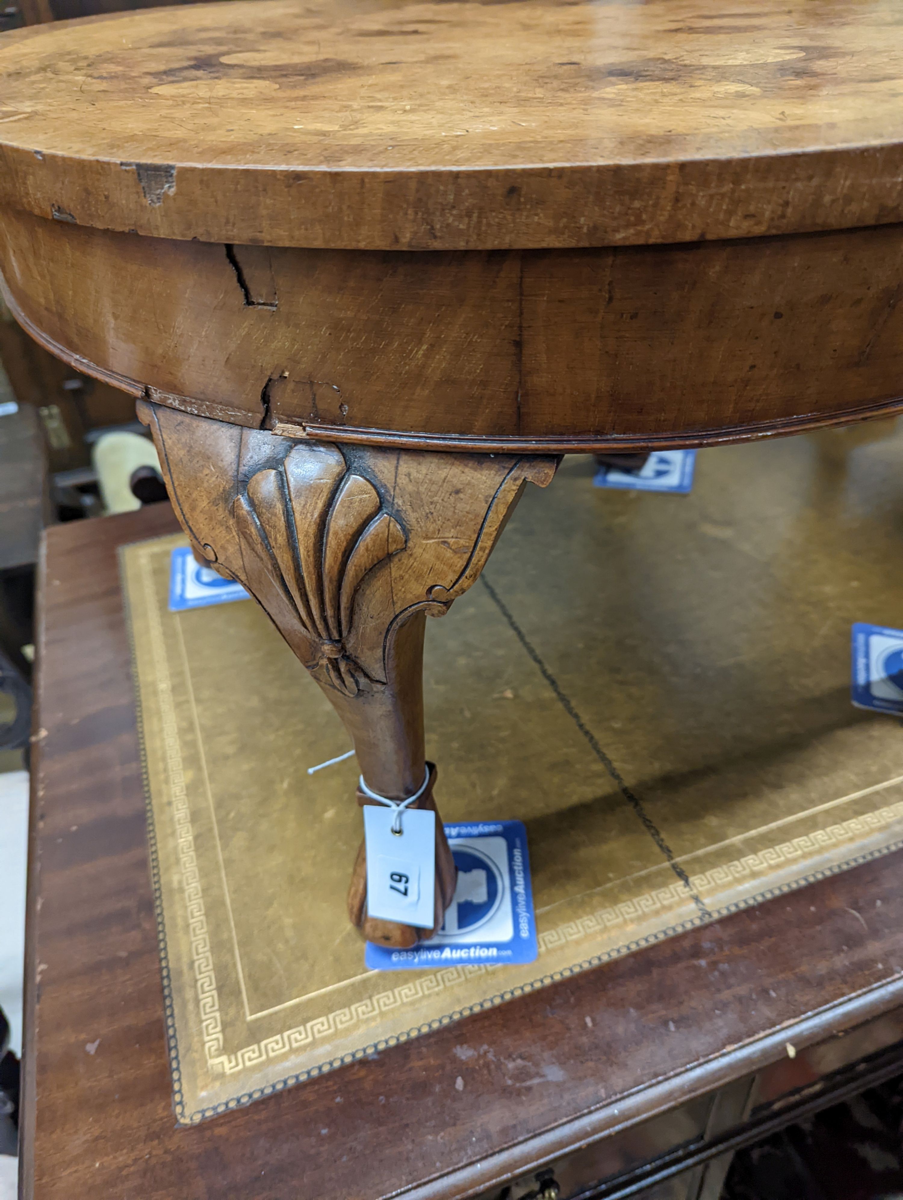 A Queen Anne revival circular walnut occasional table, diameter 60cm, height 40cm together with an Arts & Crafts mirrored oak coat rack